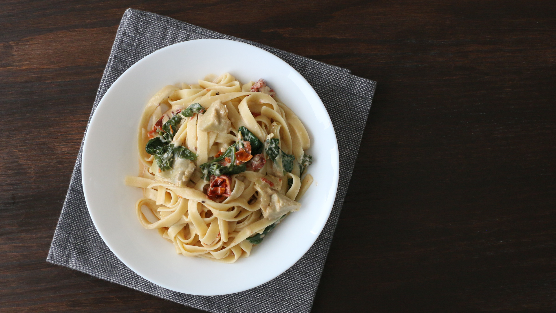 Fettuccine with Spinach, Sun-Dried Tomatoes, Artichokes, and Homemade Alfredo Sauce